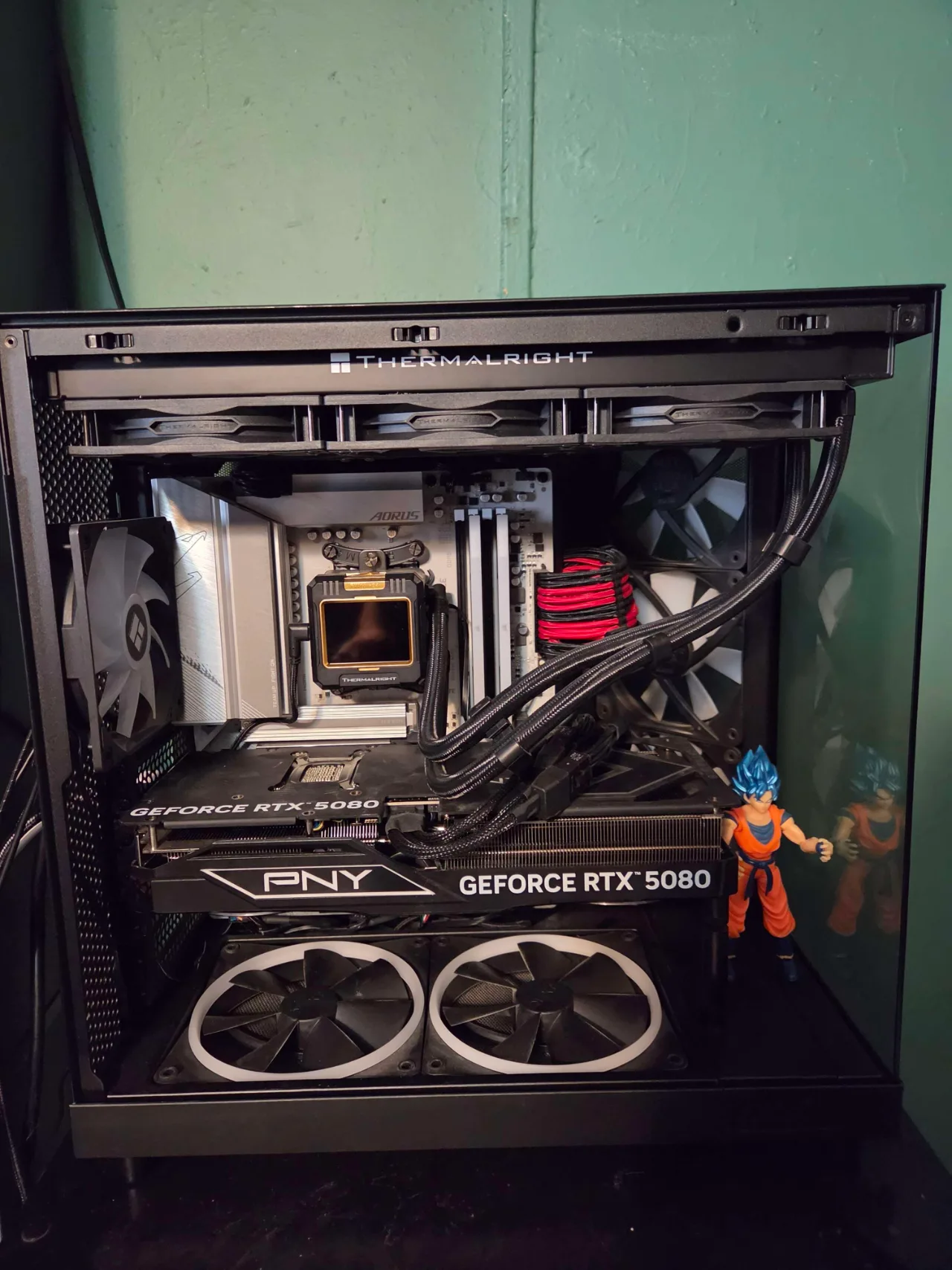Open NZXT H6 Flow workstation showing the PNY GeForce RTX 5080, Thermalright cooler, AORUS motherboard, and internal fans.